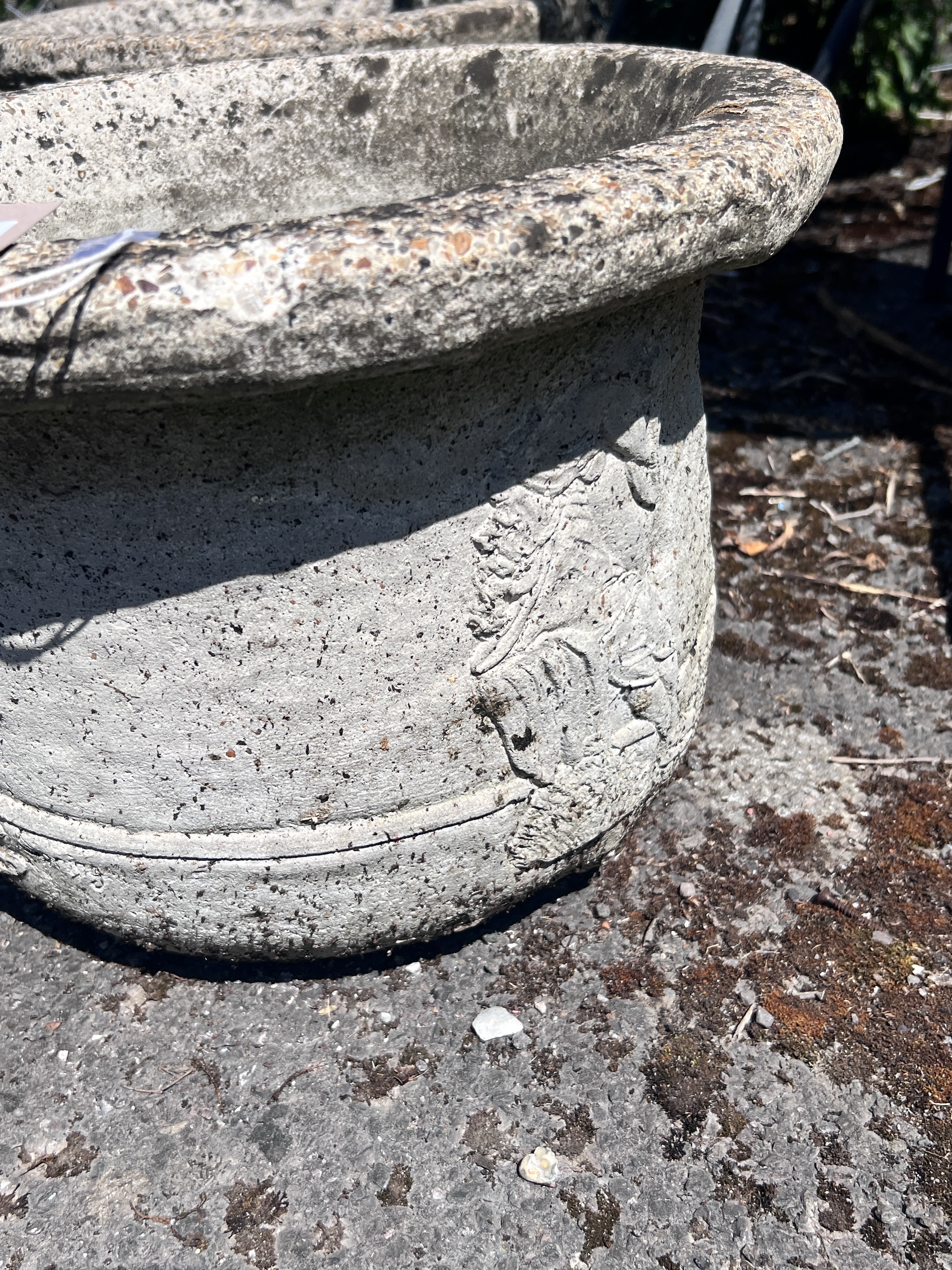 A set of four circular reconstituted stone garden planters, diameter 41cm, height 28cm